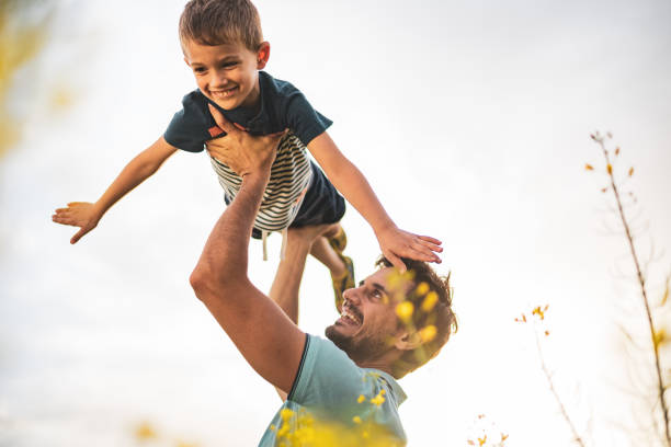 istock Father and son enjoying nature 1214955155