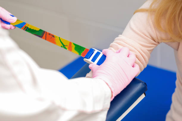 istock Tightening the harness on the arm. 1214955585