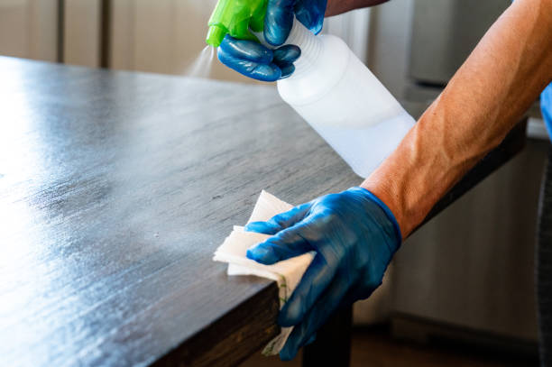 istock Man wiping down Table for Covid-19 1214956240