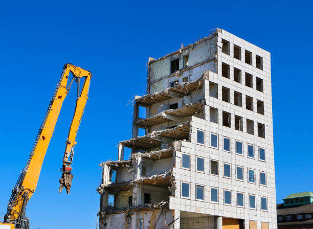 Demolished office bulding with a blue clear blue sky in the background