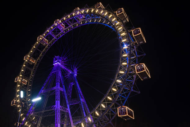 istock Ferris Wheel night carnival colorful illumination circle construction shape 1214956522