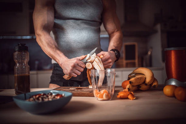 istock Male athlete in the kitchen 1214956528