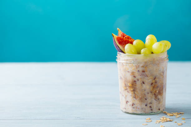 istock Overnight oats, bircher muesli with grape and figs. Blue background. Copy space. 1214958074