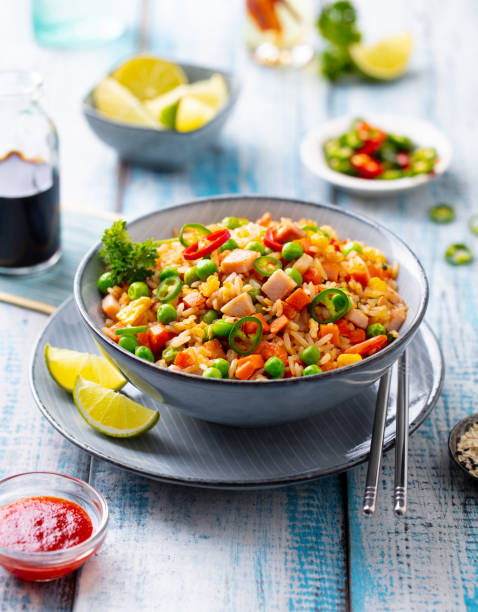 istock Asian fried rice, Cantonese cuisine. Blue wooden background. 1214958161