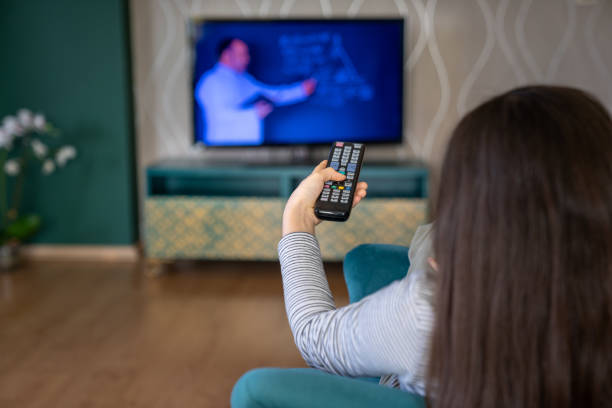 istock little girl playing with television 1214959060