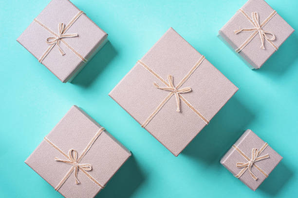istock Valentine's Day. Golden gift box on blue background. Top view. Copy space. Festive backdrop for holidays: Birthday, Valentines day, Christmas, New Year. Flat lay style. Banner 1214959141
