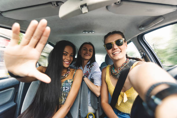 istock Happy girl having party in a car 1214959210