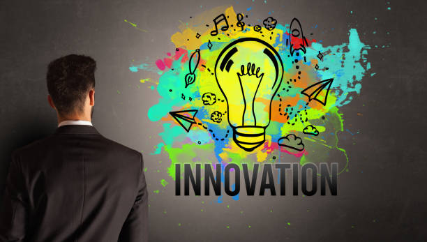 istock businessman drawing colorful light bulb 1214960589