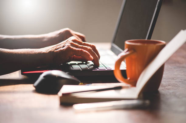 istock Senior adult working from home 1214960860