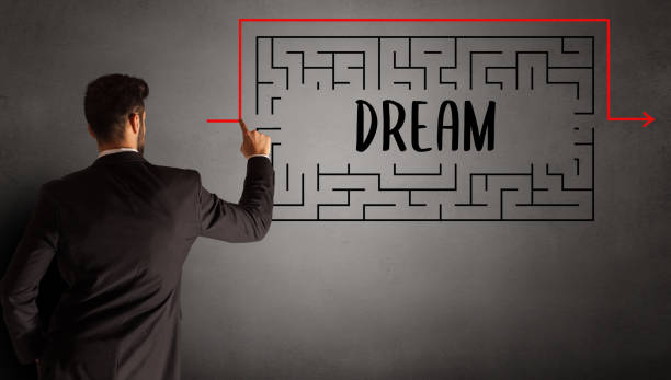 istock businessman drawing maze 1214962391
