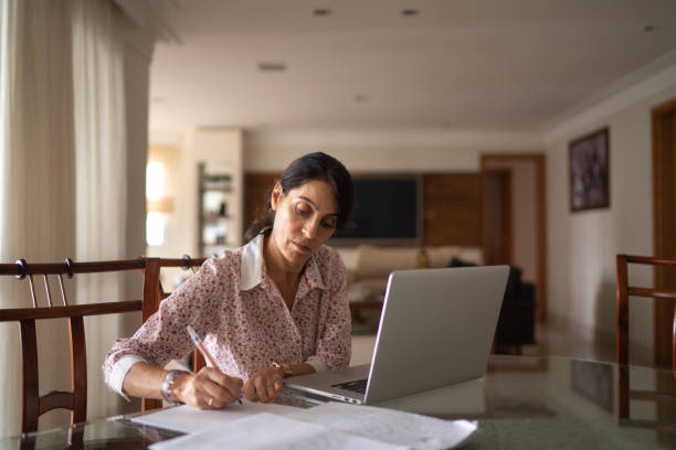 istock Senior business woman working from home 1214962920