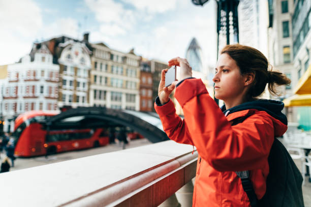 istock Solo traveler in England taking photos 1214963136