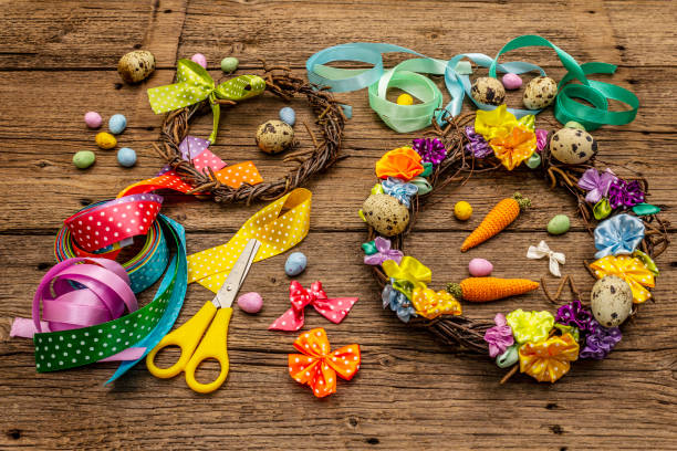 istock Hand crafted Easter wicker wreath with quail eggs and handmade flowers. Birch branches, polka dot satin ribbon. Stay at home concept 1214965454