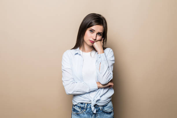 istock Young upset woman isolated on beige background 1214967901
