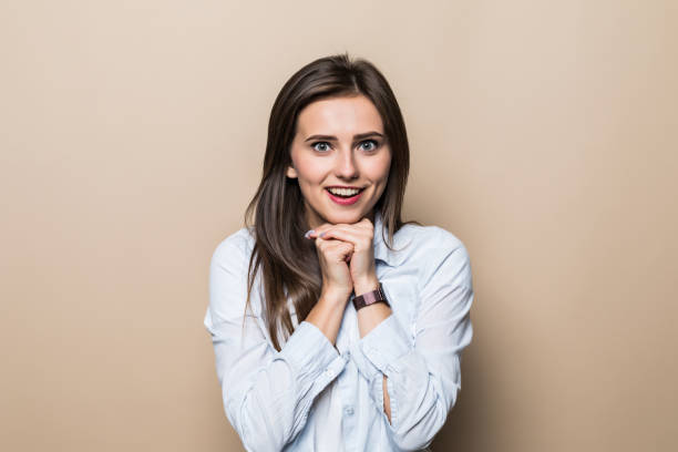 istock Young happy woman isolated on beige background 1214969106