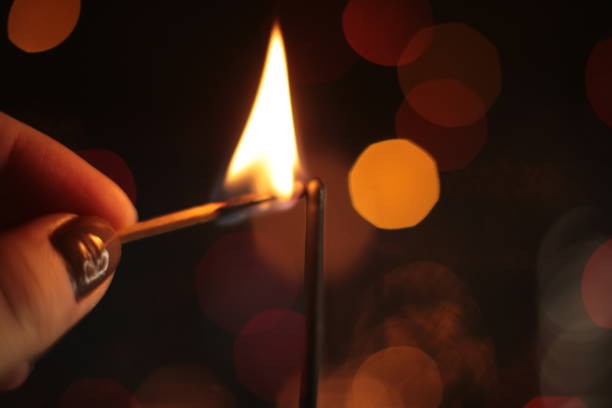 istock festive burning sparkler macro photo multicolor bokeh garlands 1214969282