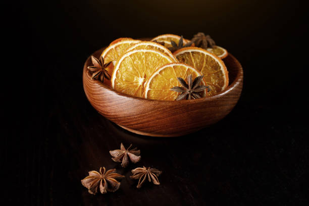 istock Dried orange slices in a wooden plate. 1214970473