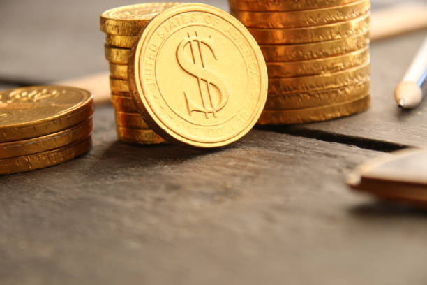istock Graph of profit growth from gold coins. 1214970817