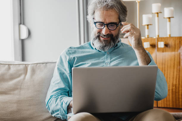 istock Mature man is working from home 1214971268