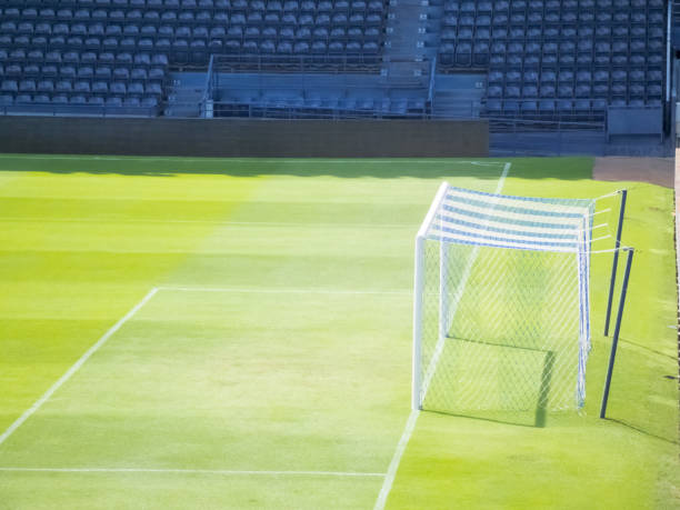 istock Football field in sunlight. 1214971296