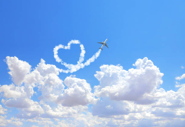 Aircraft draw a heart in the sky Aircraft draw a heart in the sky. Flight route of aircraft in shape of a heart. Love concept for traveling the world. Copy space for text words in the sky stock pictures, royalty-free photos & images