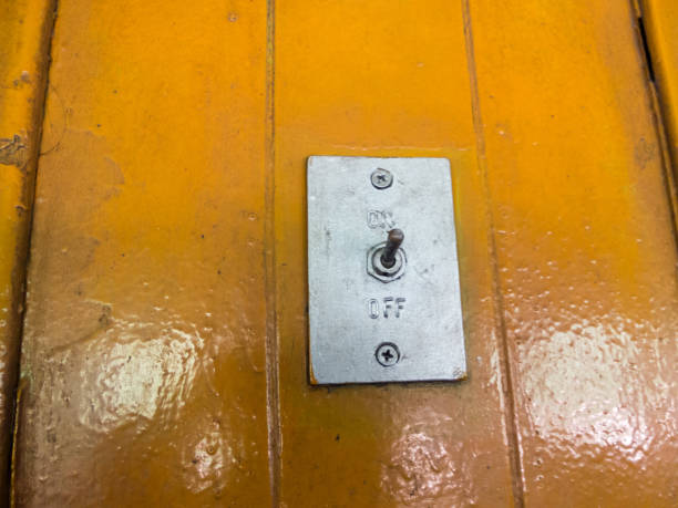 istock Switch off and on. On the old yellow wood floor. 1214973450