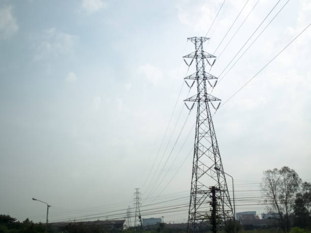 istock High-voltage pylons on a blue sky background. 1214973637