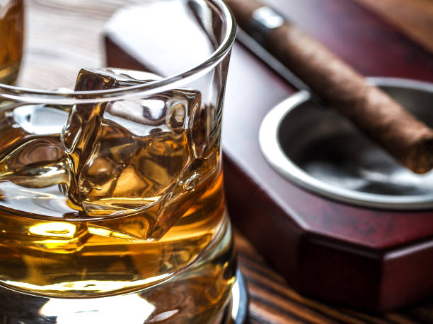 istock Whsky on the rocks and cigar 1214973765