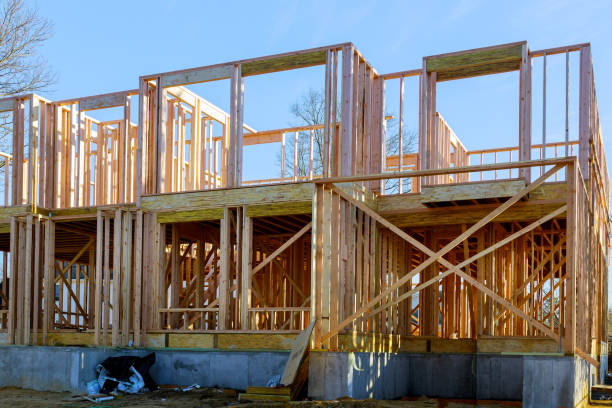 istock New construction home residential construction home framing against a blue sky 1214973852