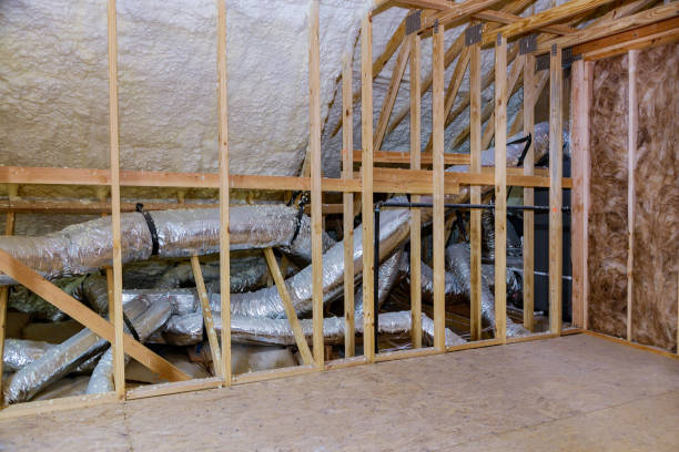 istock Building with wooden beams of a roof installing pipe heating system 1214973877