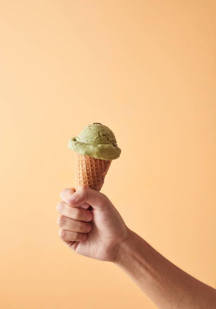 istock ice cream cone of green tea. 1214976092