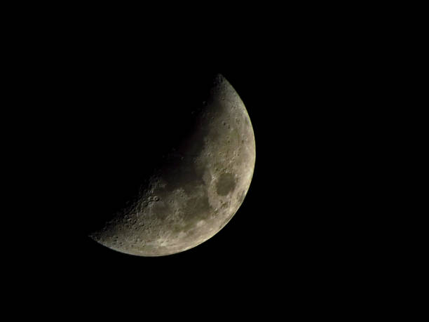 istock Part of the moon on black background 1214977491