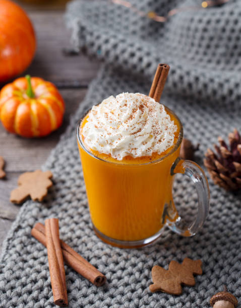 istock Pumpkin latte with spices. Boozy cocktail with whipped cream. Grey background. 1214978571