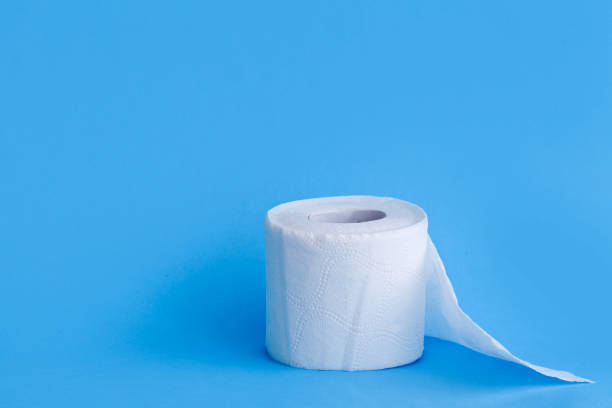 istock Toilet paper  on blue background. 1214981391