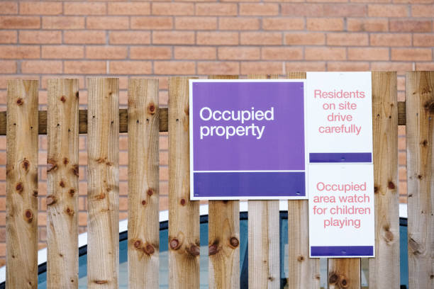 istock Building site occupied property sign 1214986282