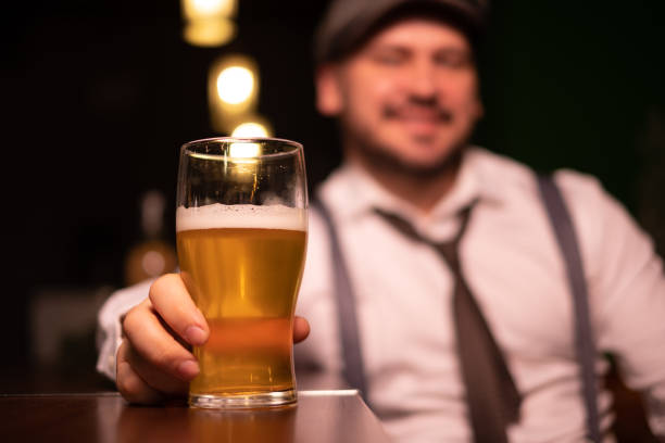 istock man seats at the bar 1214989413