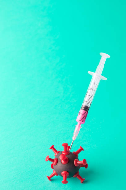 istock Covid-19 vaccination abstract made of syringe and virus cell. 1214992820