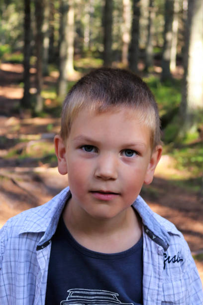 istock Young boy in woodland 1214995530
