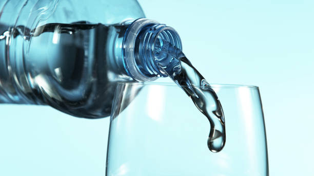 istock Freeze motion of pouring water from plastic bottle 1214996219