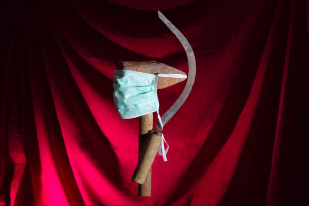 A sickle and a hammer in a medical mask.