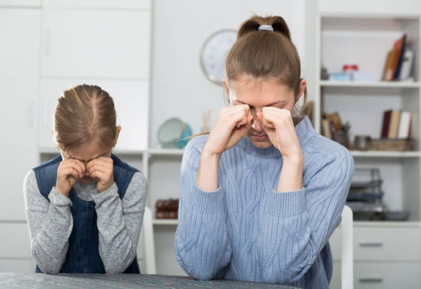 istock Crying mother and her daughter 1214997266