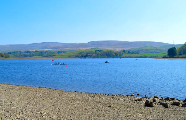 Hollingworth Lake, Littleborough, Rochdale, Greater Manchester; England; UK, Europe  - April 21, 2019 : Rowing boat in Hollingworth Lake, Rochdale in the spring sunshine