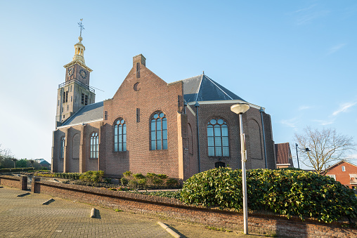 Hazerswoude-dorp, Netherlands - March 25, 2020: Reformed church in the small town of Hazerswoude-dorp, Holland. Wide angle view.
