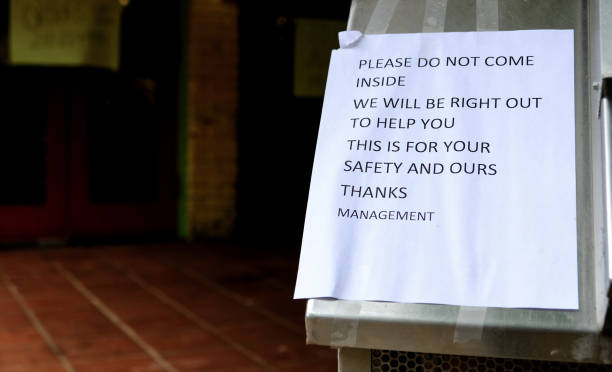 istock sign outside restaurant asking customers no to come inside in attempt to prevent the spread of corona virus. Covid-19 pandemic are forcing restaurants to serve customers only to go orders. 1215000314