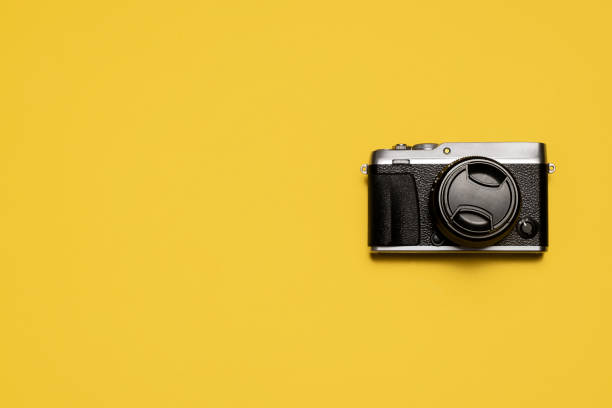 istock VIntage retro mirrorless camera on yellow 1215000341