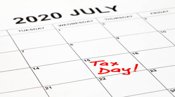 Taxes due date is set for 15th July 2020 due to corona virus outbreak. Calendar page with Tax Day written in red, remainder to pay taxes. Filling and payment was extended by the government. Taxes due date is set for 15th July 2020 due to corona virus outbreak. Calendar page with Tax Day written in red, remainder to pay taxes. Filling and payment was extended by the government. 1040 tax form photos stock pictures, royalty-free photos & images
