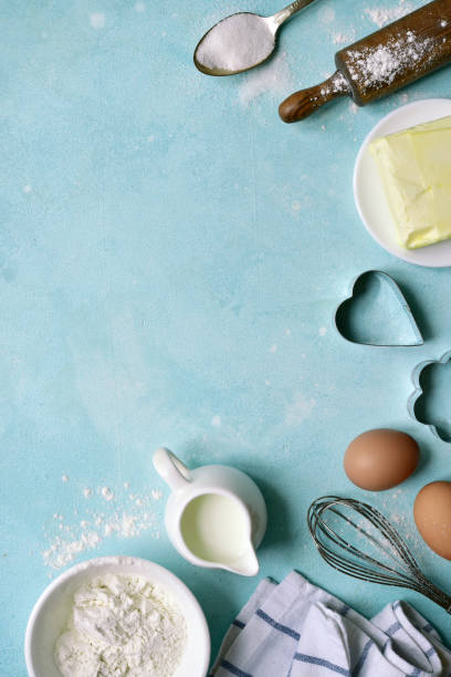 istock Culinary background with ingredients for baking : flour, butter, eggs, milk and sugar 1215001583