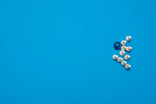 istock Bowling ball striking bowling pins on a blue background 1215001658