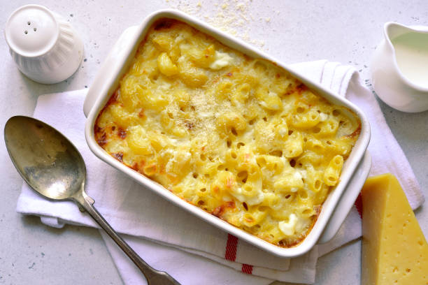 istock Mac and cheese - traditional american pasta casserole 1215001659