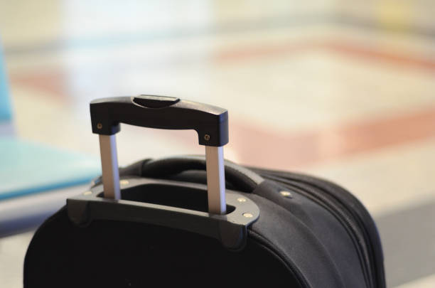 istock Black suitcase is at  train station or airport 1215002160